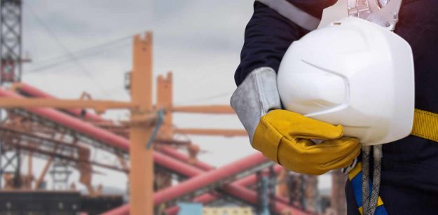 Engineer holding his helmet at the construction site | Employer’s Guide to Kenyan Labor Laws | Njaga & Co. Advocates employment and labour laws legal service