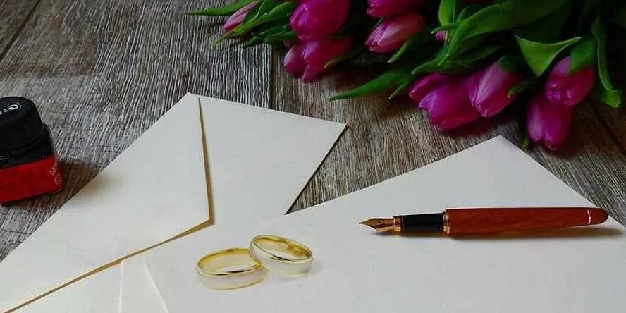 Rings on envelopes with pen and bouquet of flowers | Grounds for divorce in Kenya | Njaga & Co. Advocates family law firm in Kenya