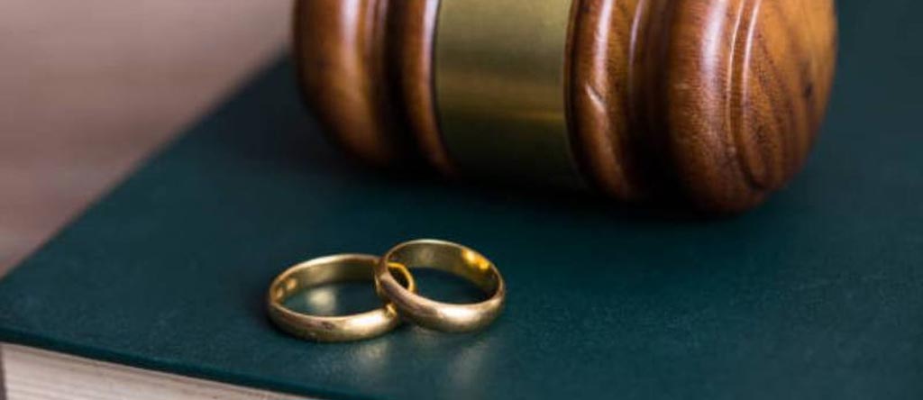 Double rings near a gavel | The Divorce Process in Kenya | Njaga & Co. Advocates family lawyer