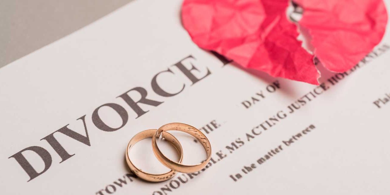 divorce-by-mutual-agreement Divorce document with broken heart paper and rings on it | Njaga & Co. Advocates family law legal services