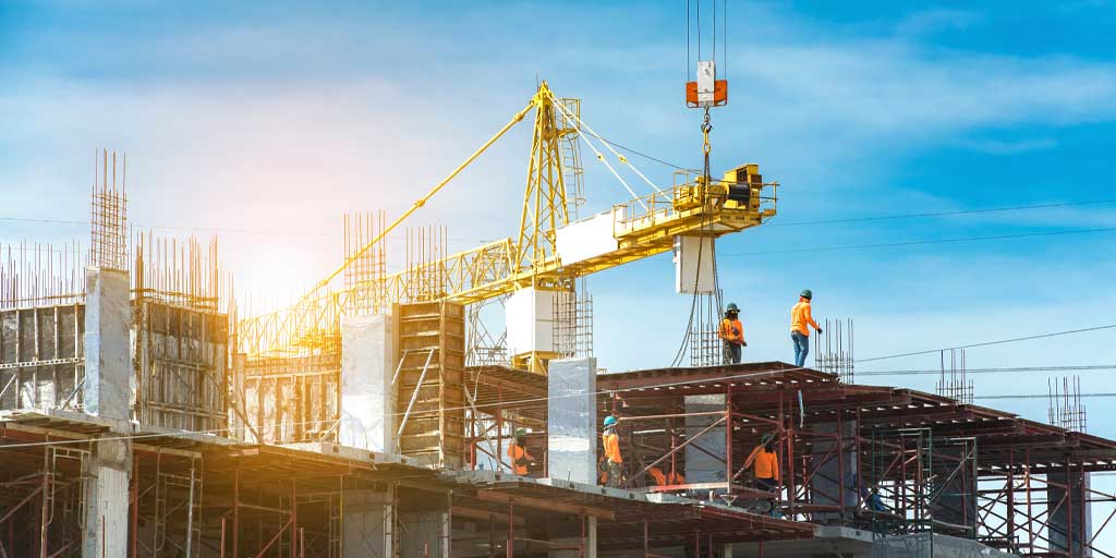 Construction crane and labor works going on ata site | Legal guide for Securing Off-Plan Properties in Kenya | Njaga Advocates property and real estate law