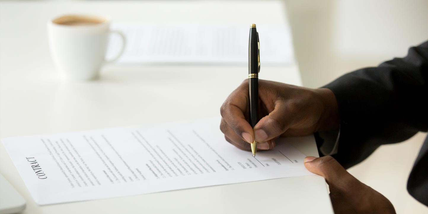 company-registration Gentleman signing documents | 10 Essential Requirements for Registering a Company in Kenya | Njaga & Co. Advocates commercial lawyers
