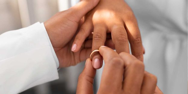 Couple exchanging rings during their wedding | Protecting Your Assets in Marriage: The Role of Prenuptial Agreements in Kenya | Njaga & Co. advocates family lawyers