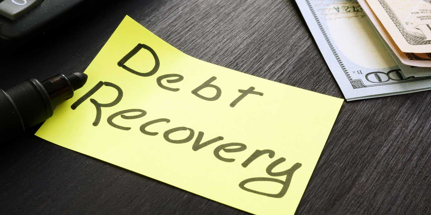 Sticky note reading debt recovery next to dollar notes | Comprehensive Guide to Debt Recovery Process in Kenya | Njaga & Co. Advocates legal articles