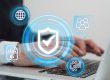 A professional working on a laptop with cybersecurity and data protection icons overlay, representing compliance | Compliance with the Data Protection Act, Kenya: A Guide for Individuals, Organizations, and Businesses | IP and TMT lawyers in Nairobi