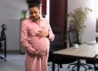 pregnant woman admiring and holding her belly in an office | Maternity and Paternity Leaves in Kenya under the Employment Act | Njaga & Co Advocates employment and labour law firm in Kenya
