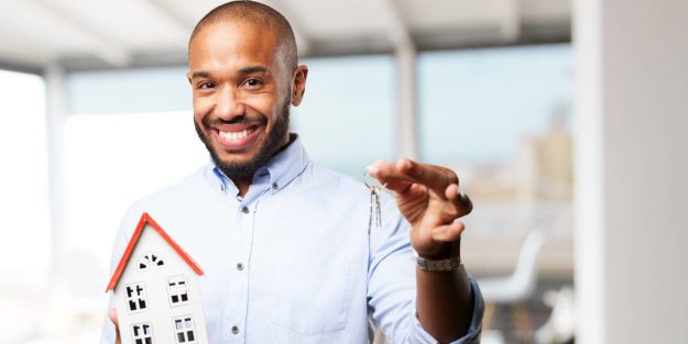 African descent with a house model and key in hands all smiles | The Doctrine of Innocent Purchaser for Value in Kenya: Meaning, Application, and Limitations in Public Land Titles | Njaga & Co. Advocates LLP legal articles