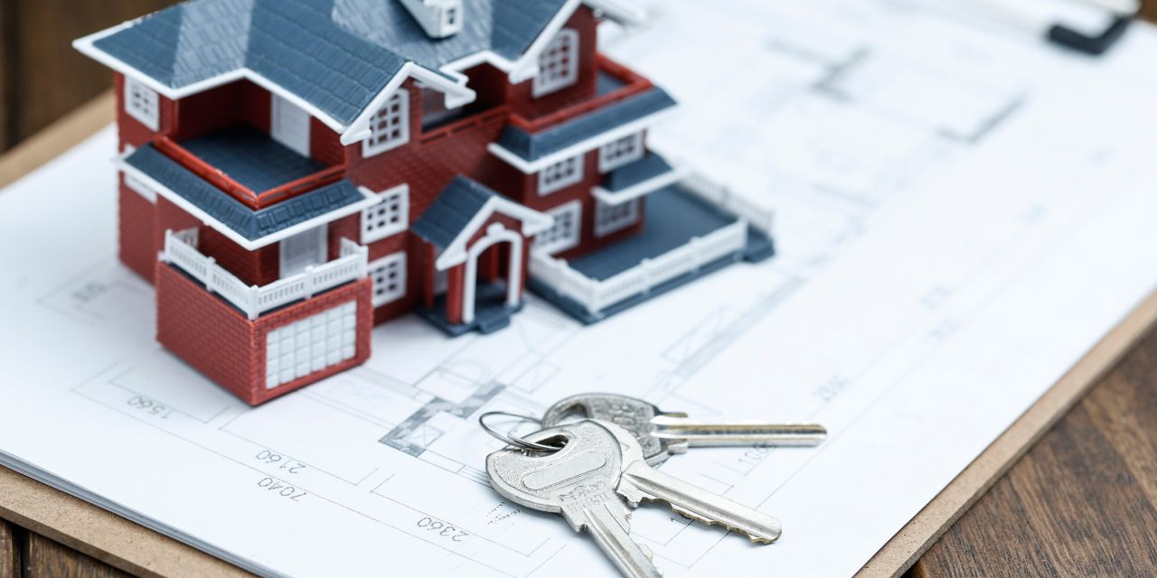 House with keys next to i on a house plan | A Guide for Perfecting Securities on Immovable Property in Kenya | Njaga & Co Advocates LLP | Property lawyers in Nairobi, real estate lawyers