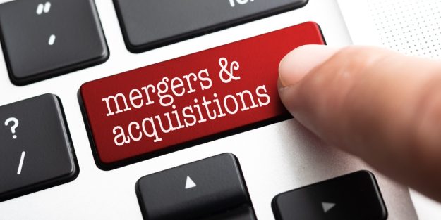 mergers and acquisitions njaga advocates Laptop keyboard with a button reading mergers & acquisitions | Understanding legal framework of mergers and acquisitions in kenya | Mergers and acquisitions lawyer in Nairobi | Njaga & Co Advocates LLP