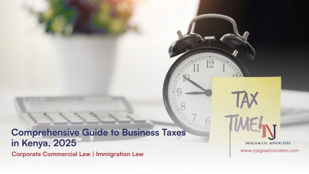 Office calculator and alarm clock next to it is a sticky note reading tax time | Guide to Business Taxes in kenya 6 taxes concept | Njaga Advocates llp in Nairobi