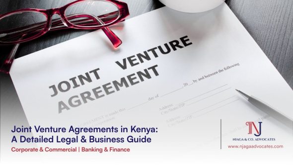 Glasses next to a Joint Venture Agreement | Joint venture agreements guide in Kenya | corporate lawyers | commercial lawyers in Kenya
