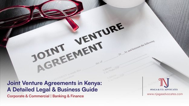 Glasses next to a Joint Venture Agreement | Joint venture agreements guide in Kenya | corporate lawyers | commercial lawyers in Kenya