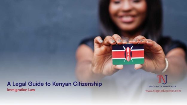 An African descent lady holding a mini Kenyan flag forward all smiles | Legal Guide to Kenyan Citizenship | 22 FAQs answered on how to become a citizen of kenya