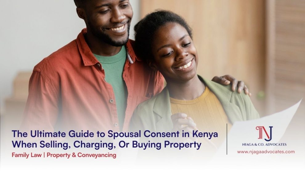 African descent couple male and lady hugging all smiles looking at a document in the lady's hands | Spousal Consent in Kenya When Selling, Charging, Or Buying Property